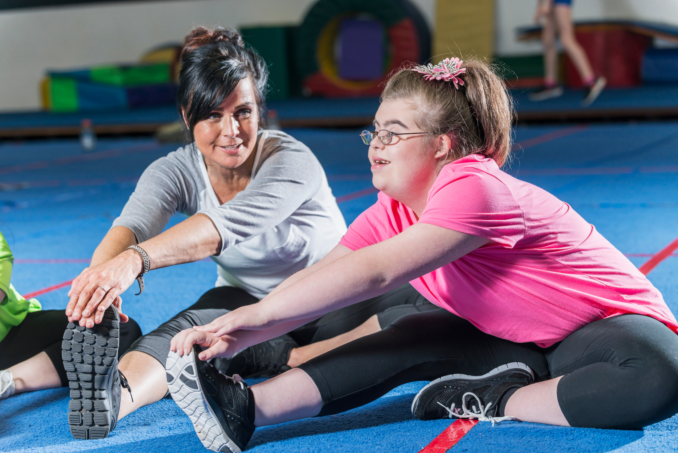 Teenage girl with down syndrome in exercise class